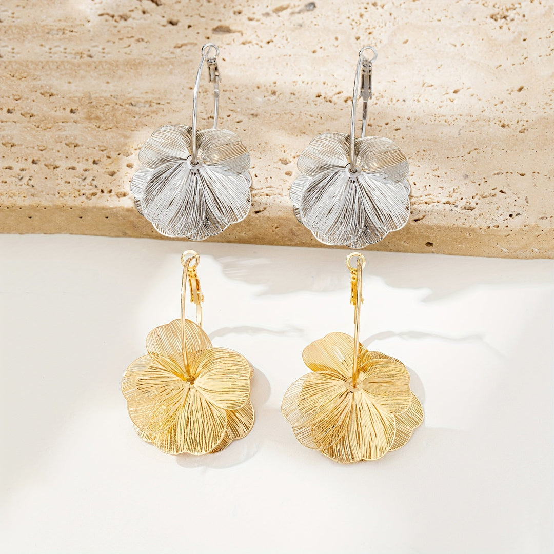 Boucles d'oreilles en or exagérées et creuses